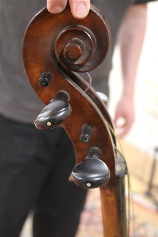 A full sized cello bearing label Arthur Richardson ... and two bows (one silver mounted), the other signed Wilhelm ... uhl